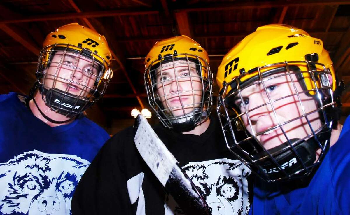Bruins hockey captains for the second year straight, from left, Phil Silbereisen, Nick Trepp and Ben Weisburger break during practice at Brunswick's Hartong Rink Tuesday afternoon, Dec. 1, 2009.