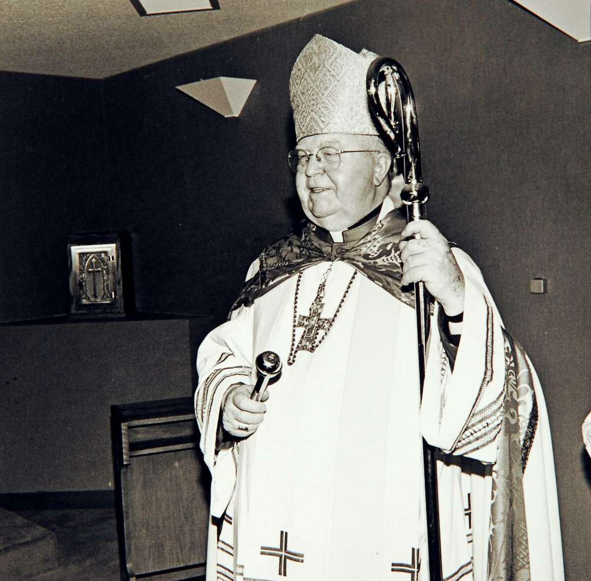 July 14th, 1988, Bishop Walter Curtis during the dedication of the St. Camillus Nursing Home on Elm Street in Stamford. Here Curtis blesses the chapel.