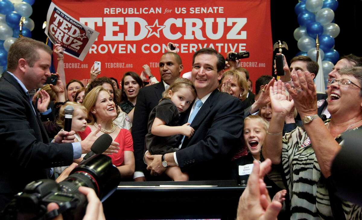 Holding his daughter Caroline, U.S. Senator candidate Ted Cruz and and his wife, Heidi, holding their daughter, Catherine, appear before a cheerful crowd after Cruz defeated Republican rival, Lt. Gov. David Dewhurst in a runoff election for the U.S. Senate seat vacated by Kay Bailey Hutchison Tuesday, July 31, 2012, in Houston. (AP Photo/Houston Chronicle, Johnny Hanson) MANDATORY CREDIT