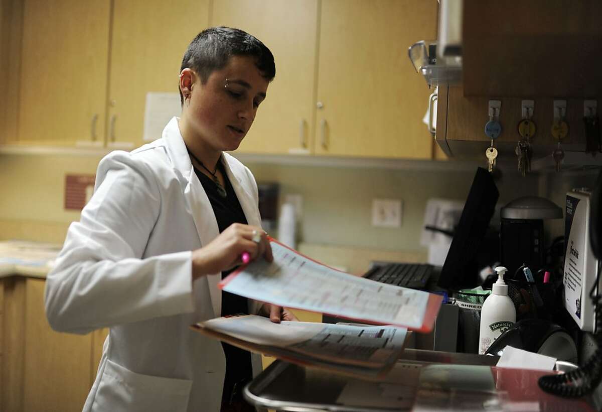 Alexa Prussin, center director, reviews patients' charts at Planned Parenthood on Tuesday, July 31, 2012 in San Francisco, Calif.