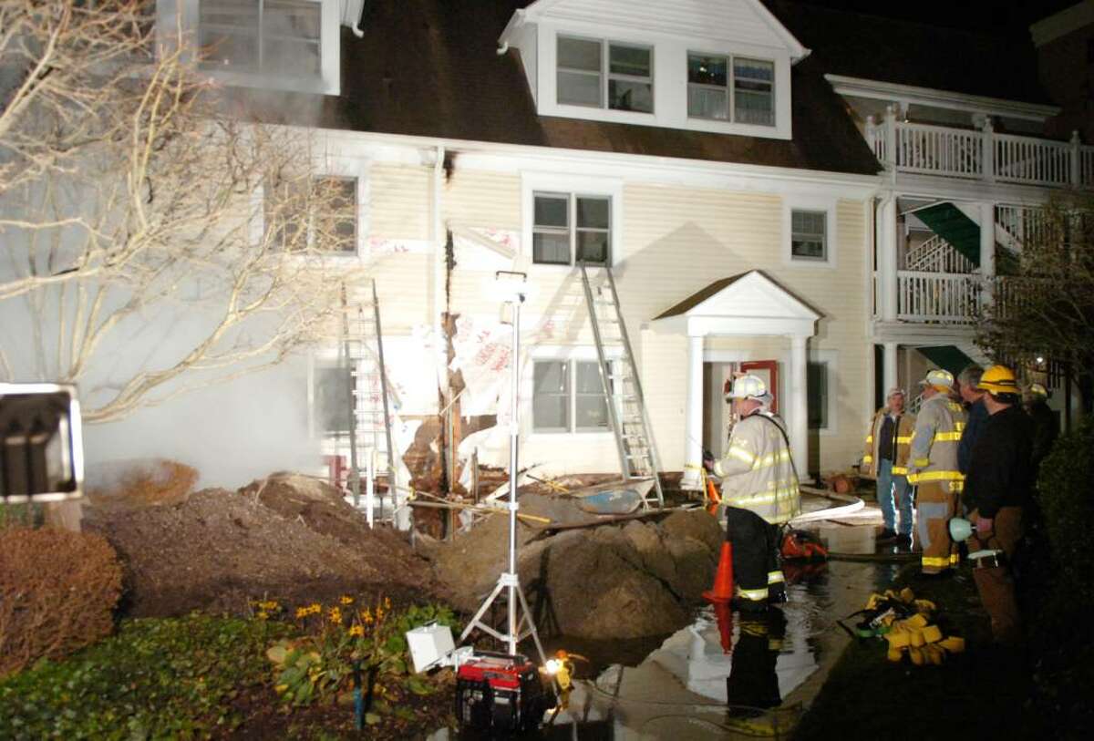 The scene of a structure fire at the Old Greenwich Gables condominium complex at 51 Forest Avenue late Tuesday, Dec. 1, 2009. The fire spread through several units displacing numerous residents and causing extensive damage to exterior of the building; the battle to contain it went well into the night.