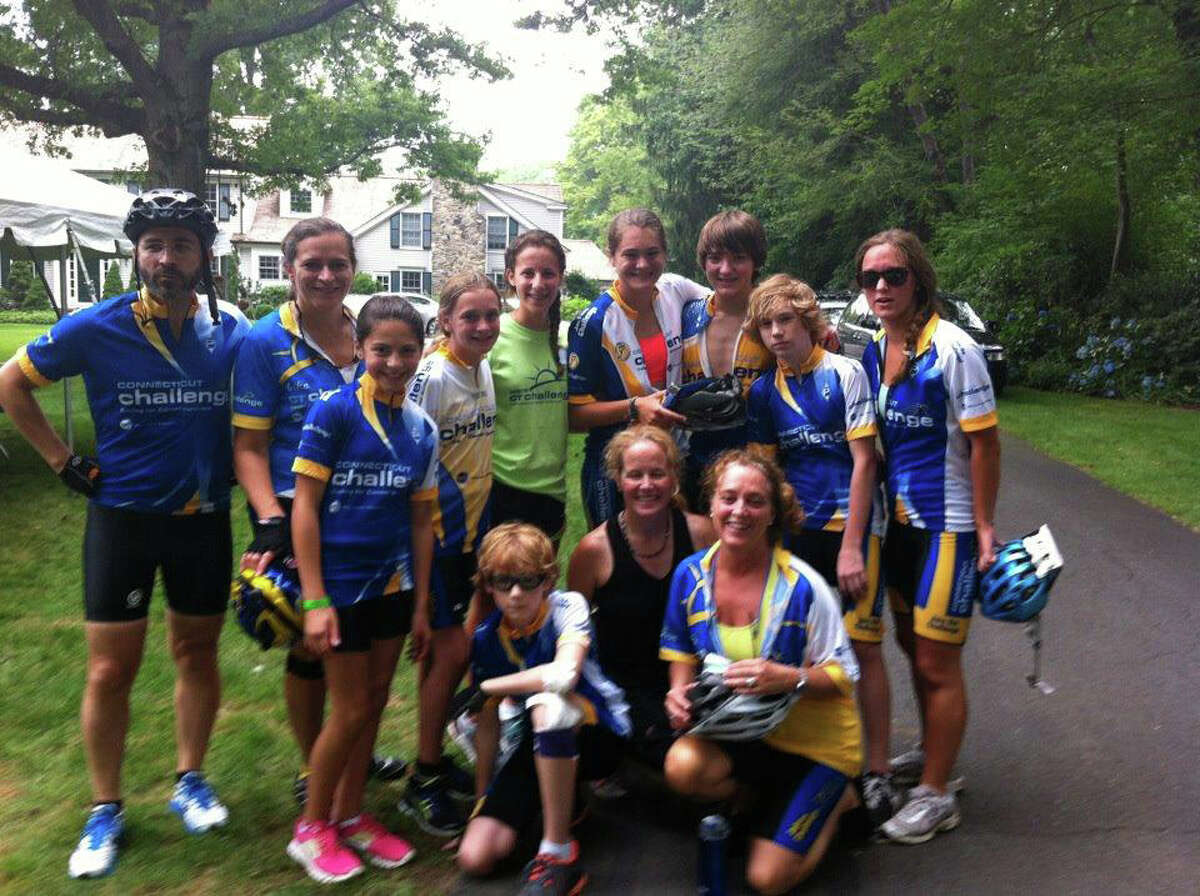 Team Darien-New Canaan takes a quick break at one of the rest stops of the 25-mile course at the eighth annual CT Bike Ride Challenge on Saturday in Westport. Photo: Contributed Photo / CT