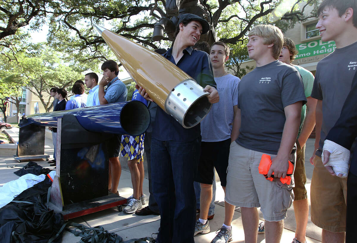 Alamo Heights High School graduate Drew Gaiennie holds the nose cone of a rocket that he and other aero-science students at the school built during an unveiling ceremony on Thursday, August 2, 2012. The 22-feet tall rocket will be launched at White Sands Missile Testing Range in New Mexico next week. The students all took part in building the rocket in their Aero-Science class headed up by teacher Colin Lang. Their goal is to send the rocket up 100,000 feet at a speed of Mach 3.