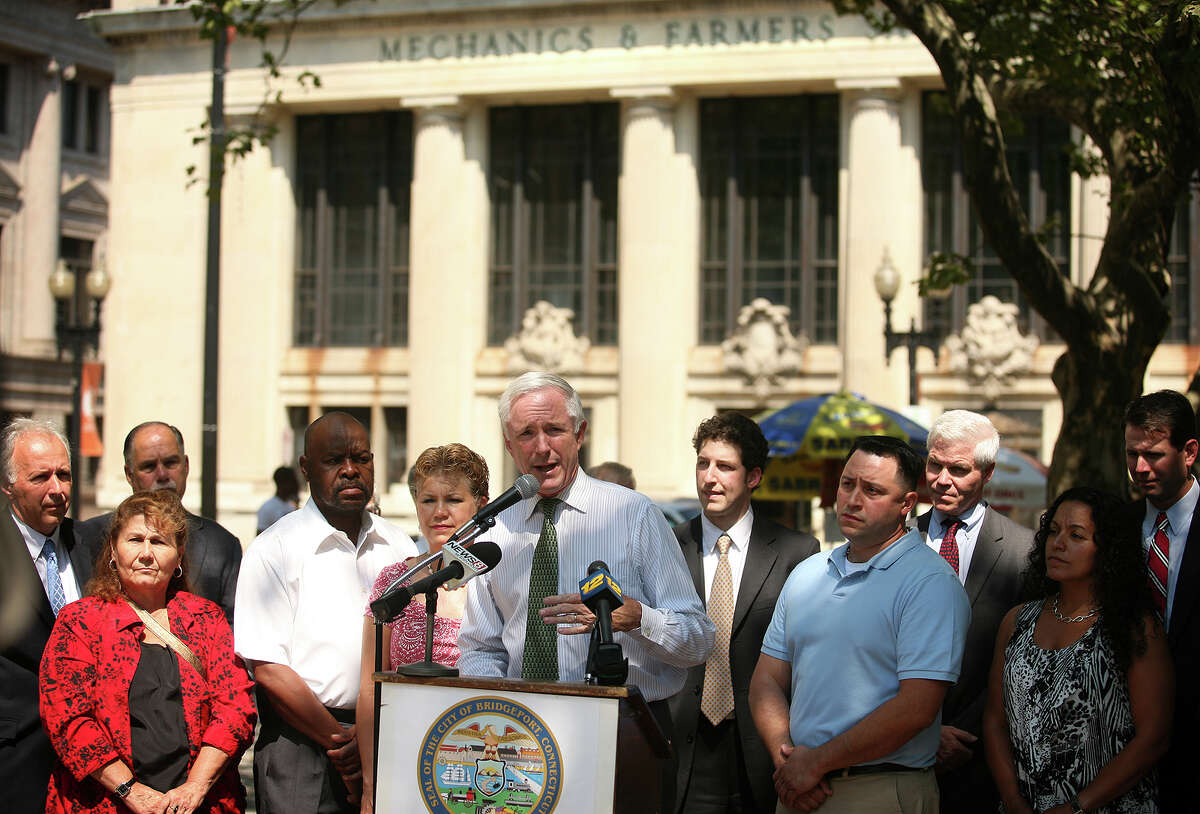 Bridgeport Mayor Bill Finch announces that three city affordable housing development projects, including the Mechanics & Farmers bank building, received state grant money, on McLevy Green in downtown Bridgeport on Thursday, August 2, 2012.
