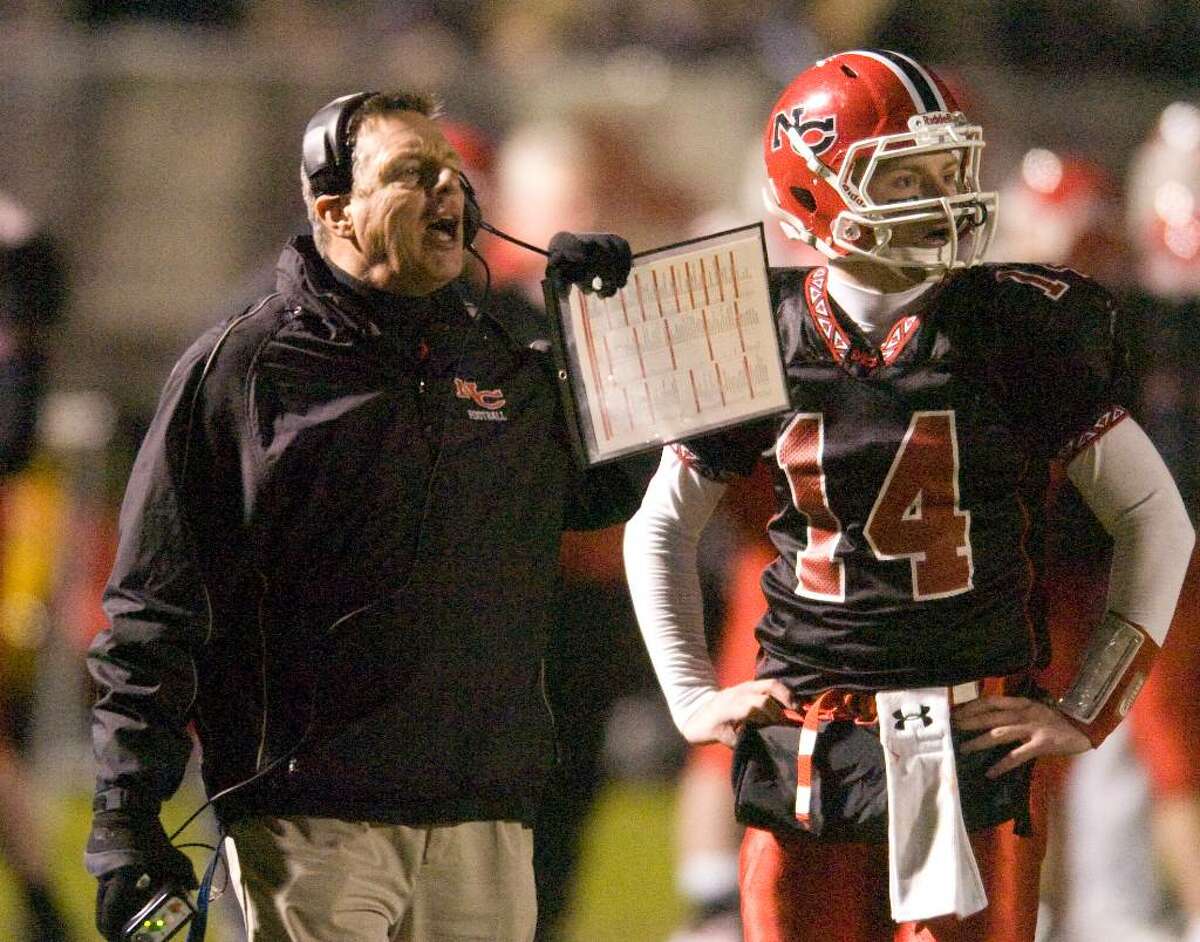 New Canaan head coach Lou Marinelli, left, and quarterback Turner Baty, right, during the CIAC Class MM semi-finals at New Canaan High School in New Canaan, Conn. on Tuesday, Dec. 1, 2009.