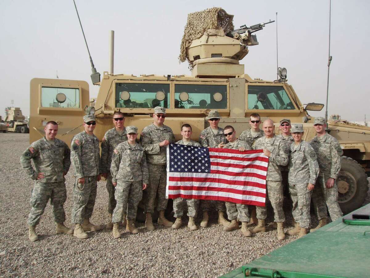 ARMY Then Col. Patricia Anslow, second from right, gathers with some of her 875th Engineer Battalion soldiers in the Iraq war.