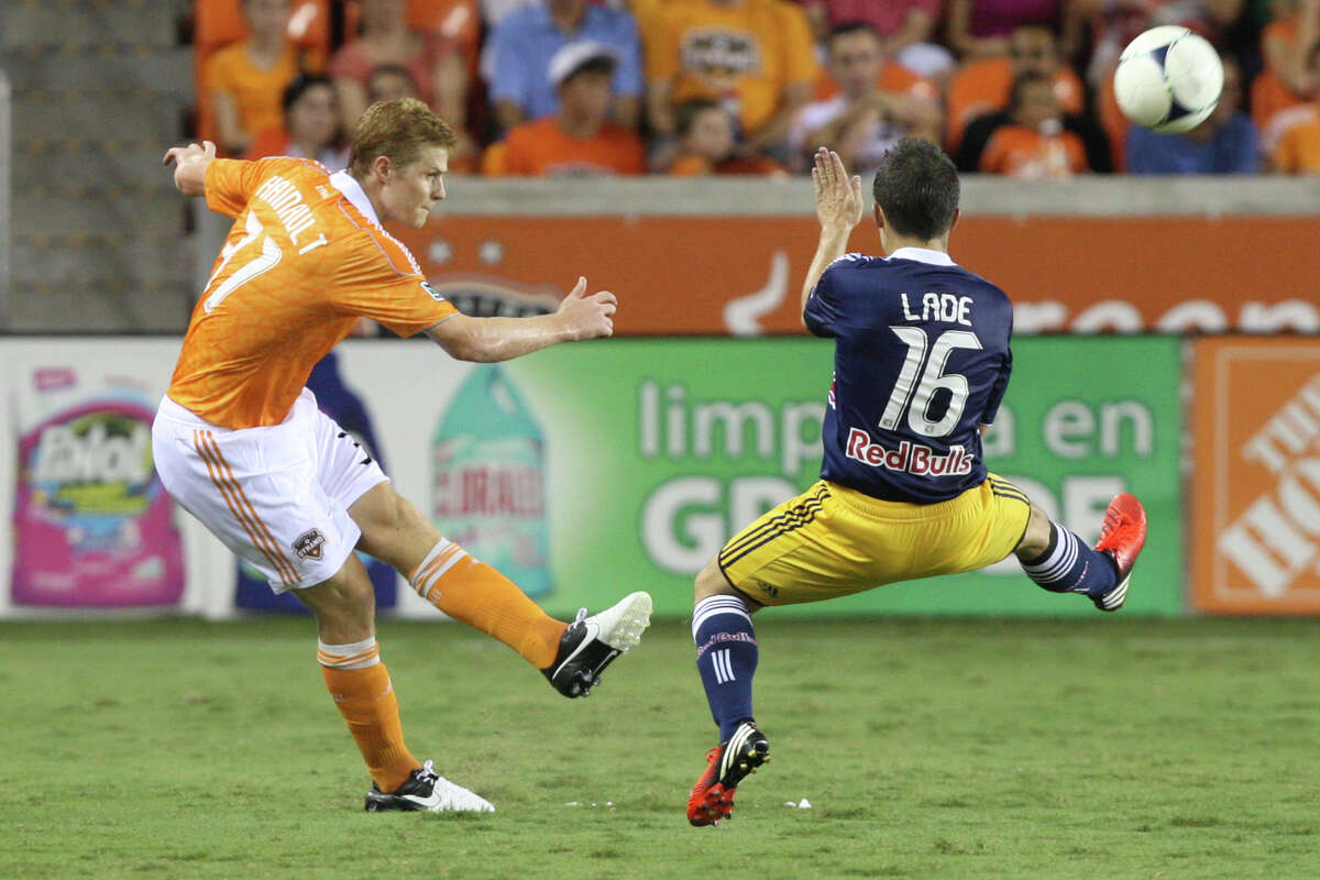 Houston Dynamo defender Andre Hainault, left, was called up by the Canadian national team.
