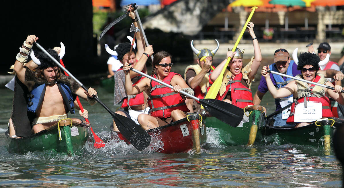 A group of U.S. Army personnel from Fort Sam Houston don Viking costumes as they participate in the 44th annual Ford Canoe Challenge along the River Walk on Saturday, August 4, 2012. About 100 teams that included Boy Scouts and Girls Scouts, corporate and celebrity participants took part in one of the oldest events held on the river.