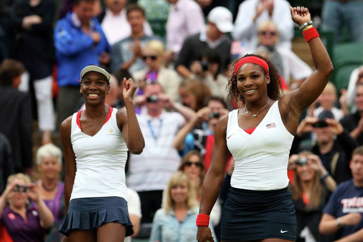 LONDON, ENGLAND - AUGUST 05: Serena Williams (R) and Venus Williams (L) of the United States celebrate after defeating Andrea Hlavackova and Lucie Hradecka of Czech Republic in the Women's Doubles Tennis gold medal match on Day 9 of the London 2012 Olympic Games at the All England Lawn Tennis and Croquet Club on August 5, 2012 in London, England.