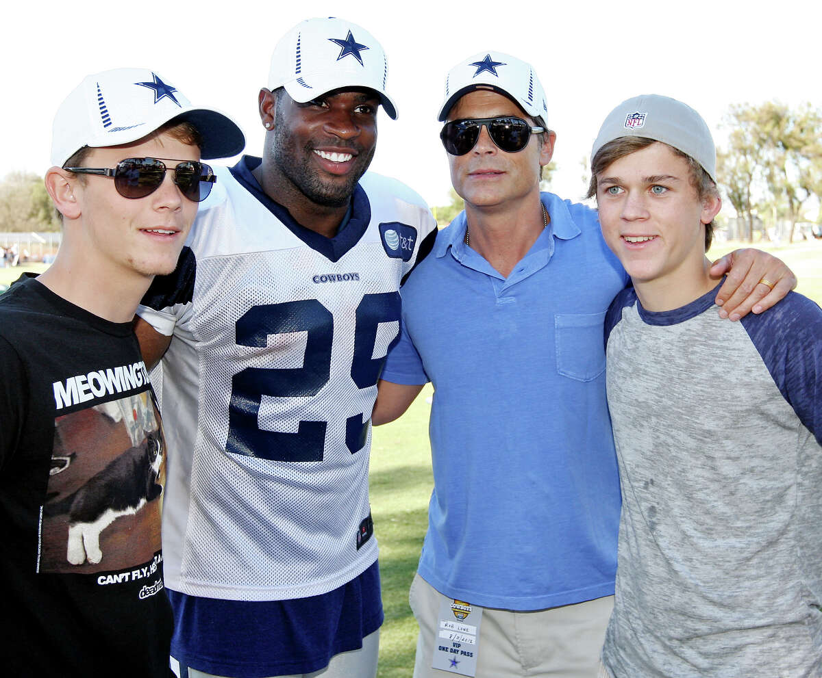 Matt Lowe (from left), Dallas Cowboys running back DeMarco Murray, actor Rob Lowe, and John Owen Lowe pose for a photo after the Blue-White scrimmage at the 2012 training camp held Sunday Aug 5, 2012 in Oxnard, CA.