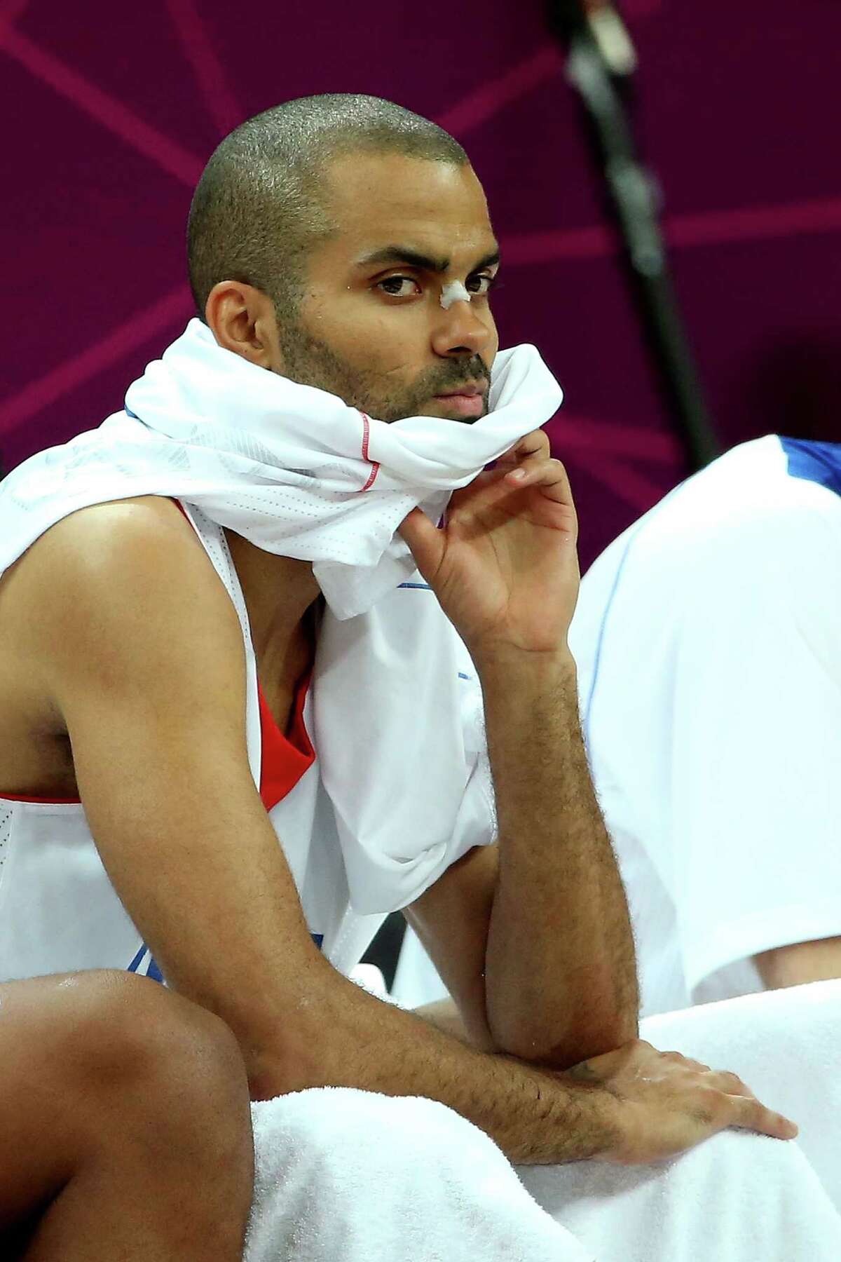 LONDON, ENGLAND - AUGUST 06: Tony Parker of France looks on form the bench in the second half against Nigeria during the Men's Basketball Preliminary Round match on Day 10 of the London 2012 Olympic Games at the Basketball Arena on August 6, 2012 in London, England. France won 79-73.