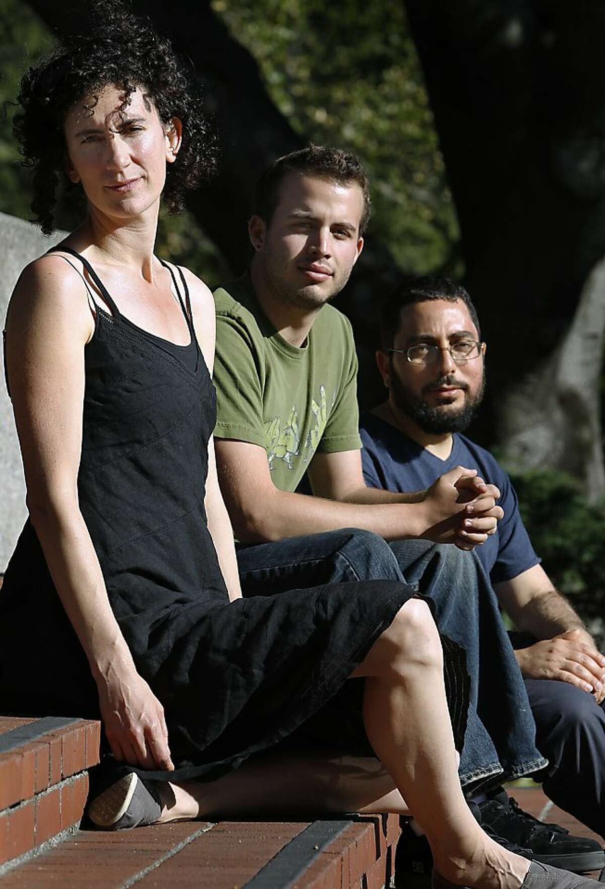 Liz Jackson (left), Roi Bachmutsky (center) and Tom Pessah are seen in Berkeley, Calif. on Saturday, July 28, 2012. Bachmutsky, an undergraduate at UC Berkeley, and Pessah, a graduate student, support the petition drive against the recommendations of the report. Jackson is a former UC Berkeley student who is in the National Lawyers' Guild and helped write a letter complaining about the report.