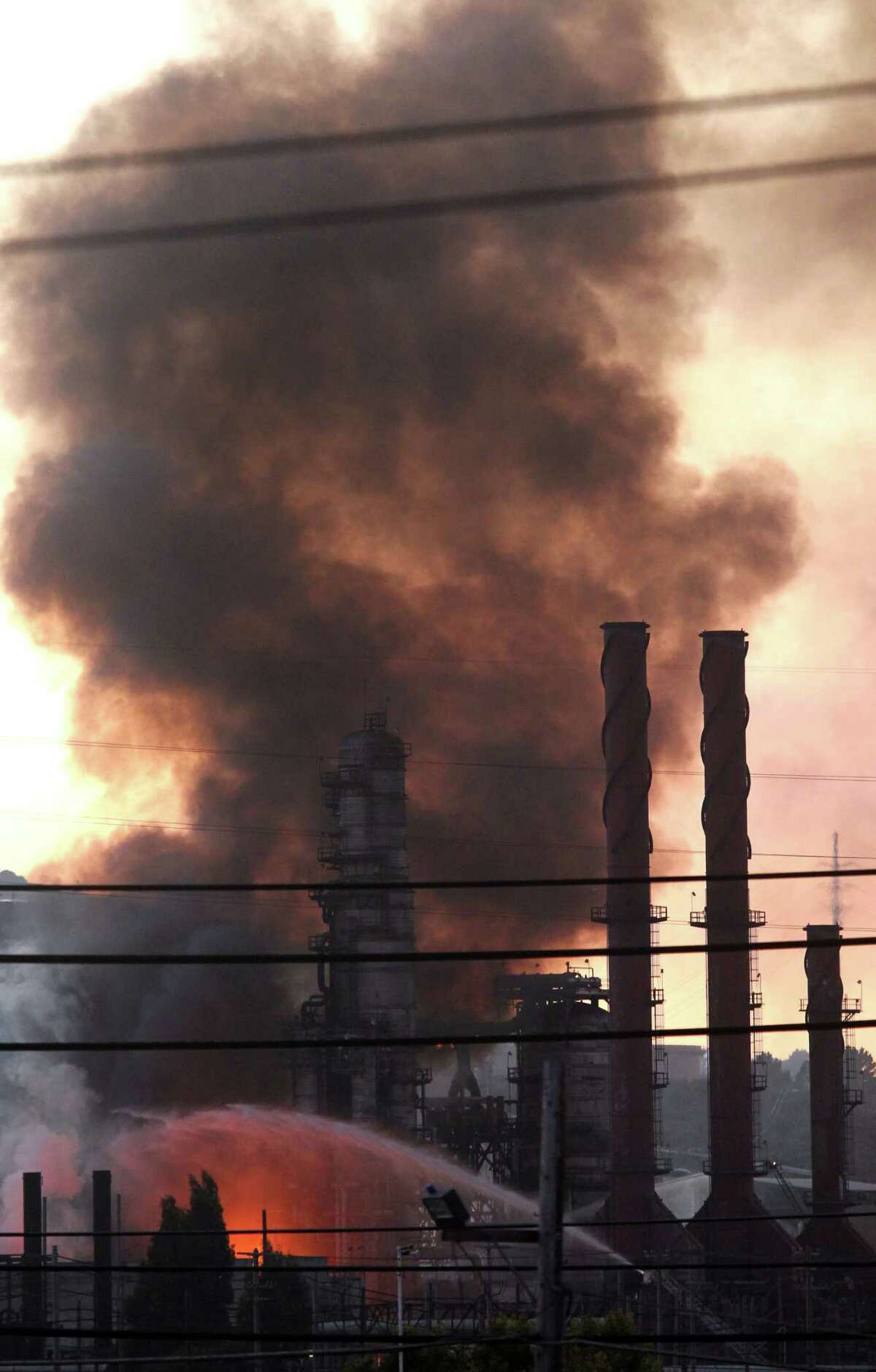 Fire crews battle the Chevron refinery fire in Richmond on Aug. 6, 2012.