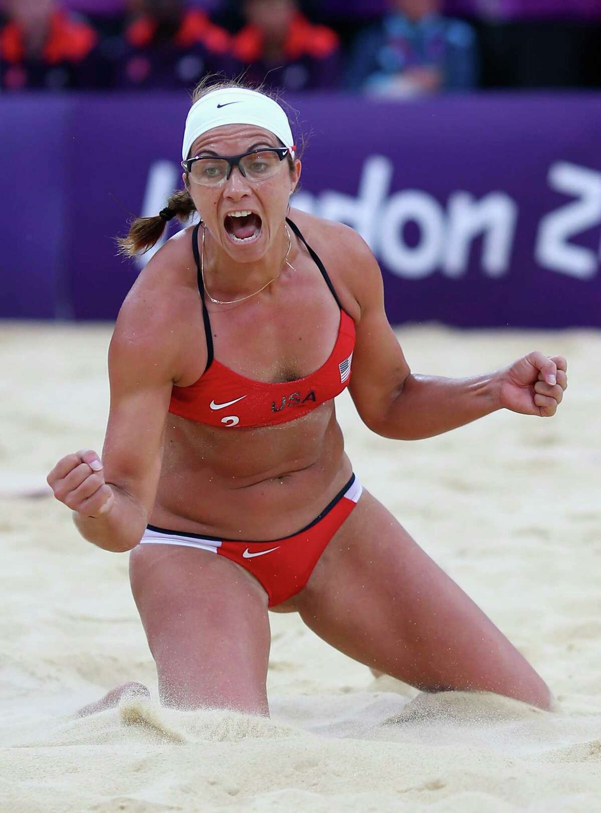 LONDON, ENGLAND - AUGUST 07: Misty May-Treanor of the United States celebrates during the Women's Beach Volleyball Semi Final match between United States and China on Day 11 of the London 2012 Olympic Games at Horse Guards Parade August 7, 2012 in London, England.