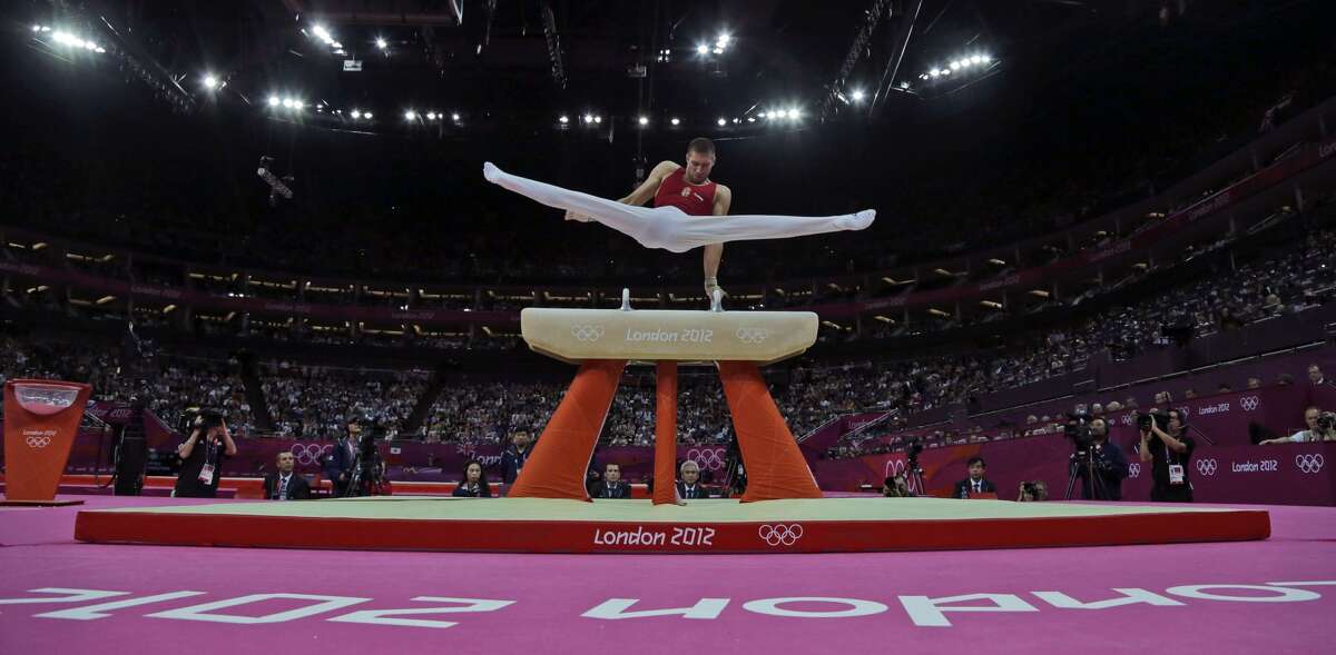 Gymnast Krisztian Berki of Hungary performs during the artistic gymnastics men's pommel horse final at the 2012 Summer Olympics, Sunday, Aug. 5, 2012, in London. Berki won the gold medal. (Julie Jacobson / Associated Press)