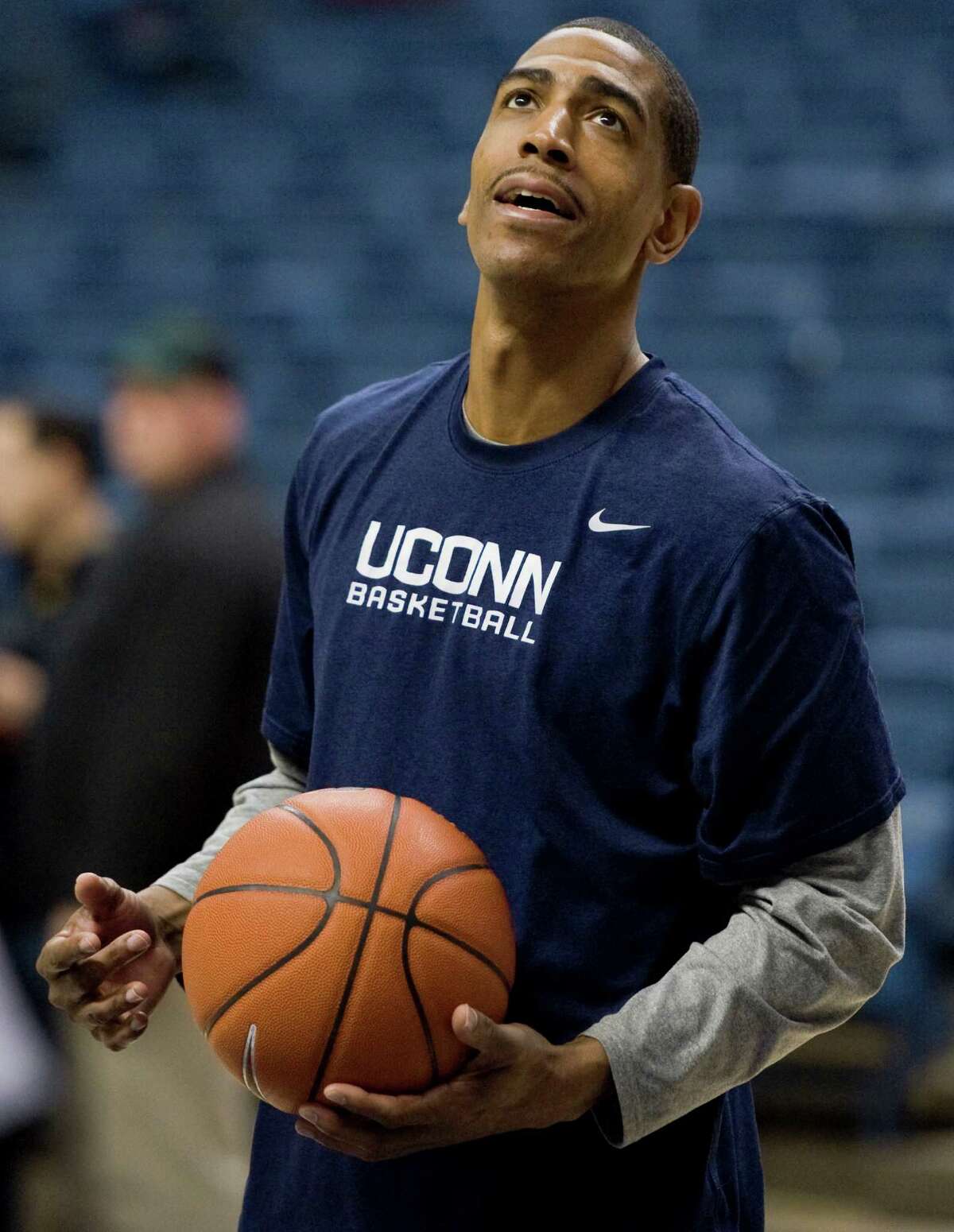 Connecticut assistant coach Kevin Ollie watches practice at the University of Connecticut in Storrs, Conn., Friday, Feb. 3, 2012. (AP Photo/Jessica Hill)