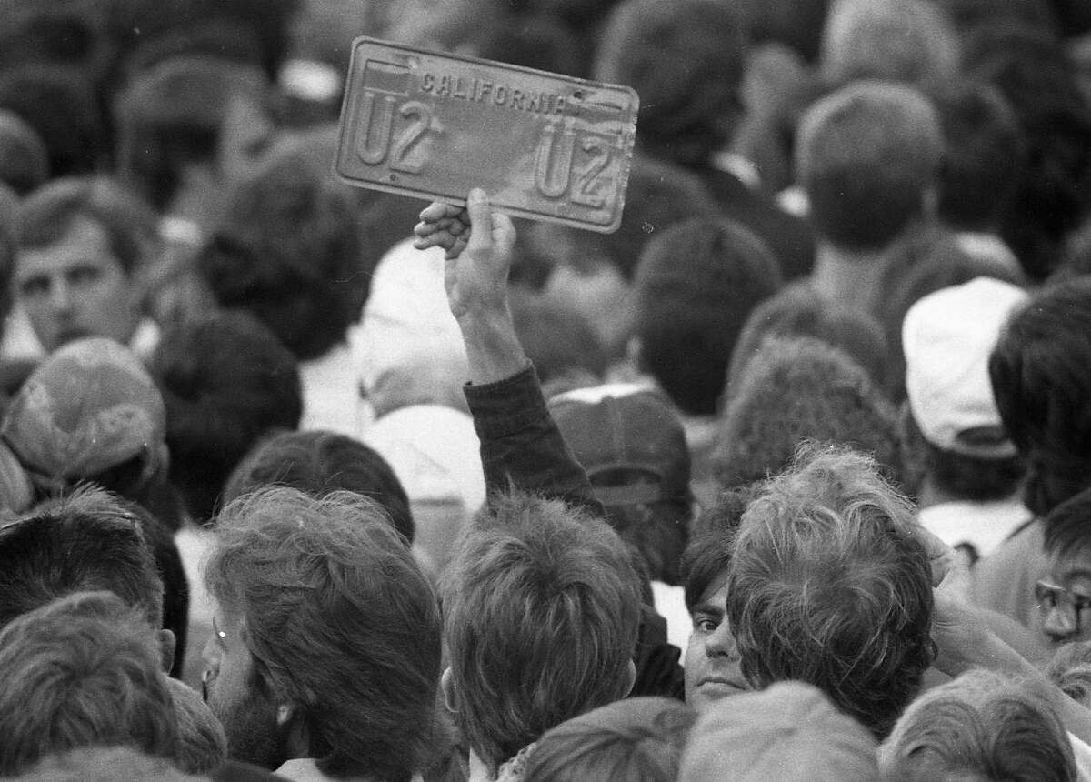 Nov. 11, 1987: With just two hours notice, 20,000 people showed up in Justin Herman Plaza to watch U2's free "Save the Yuppie" concert. (Fred Larson / The Chronicle)