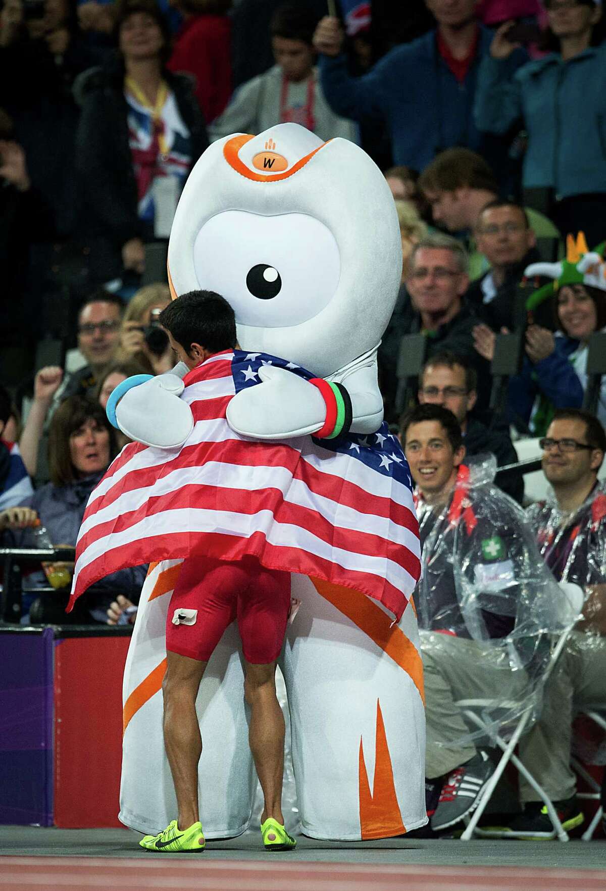 Leo Manzano of the USA gets a hug from London 2012 macot Wenlock after winning the silver medal in the men's 1,500-meters final during at the 2012 London Olympics on Tuesday, Aug. 7, 2012.