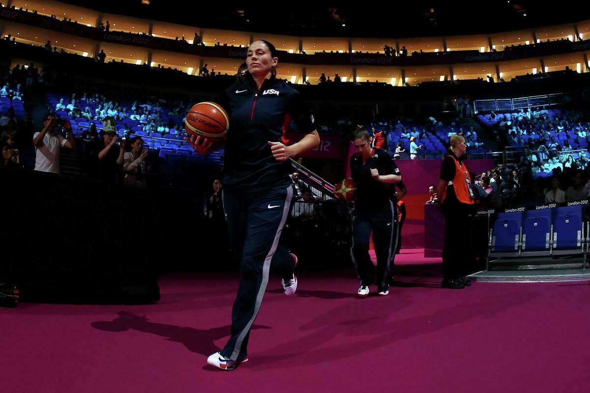 LONDON, ENGLAND - AUGUST 09: Sue Bird of United States lead teammates out onto the floor before the Women's Basketball semifinal against Australia on Day 13 of the London 2012 Olympics Games at North Greenwich Arena on August 9, 2012 in London, England.