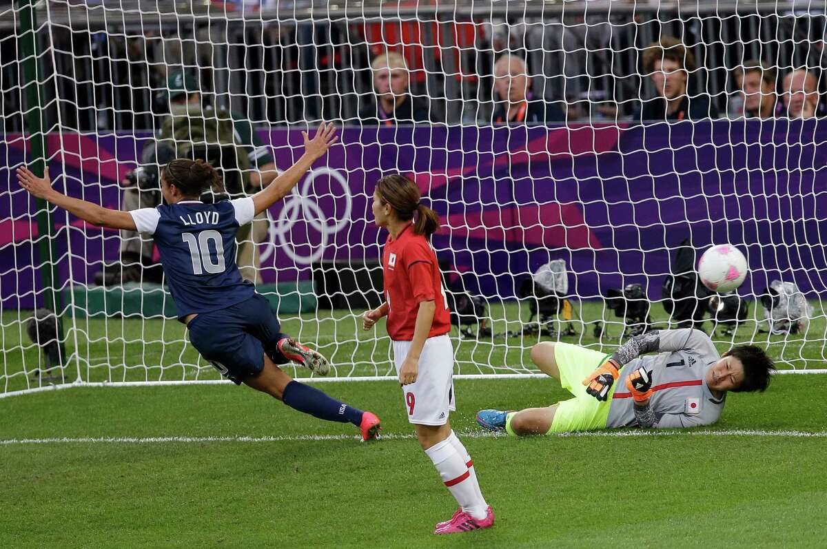 United States' Carli Lloyd (10) celebrates after scoring against Japan goalkeeper Miho Fukumoto (1) during the women's soccer gold medal match at the 2012 Summer Olympics, Thursday, Aug. 9, 2012, in London. (AP Photo/Andrew Medichini)