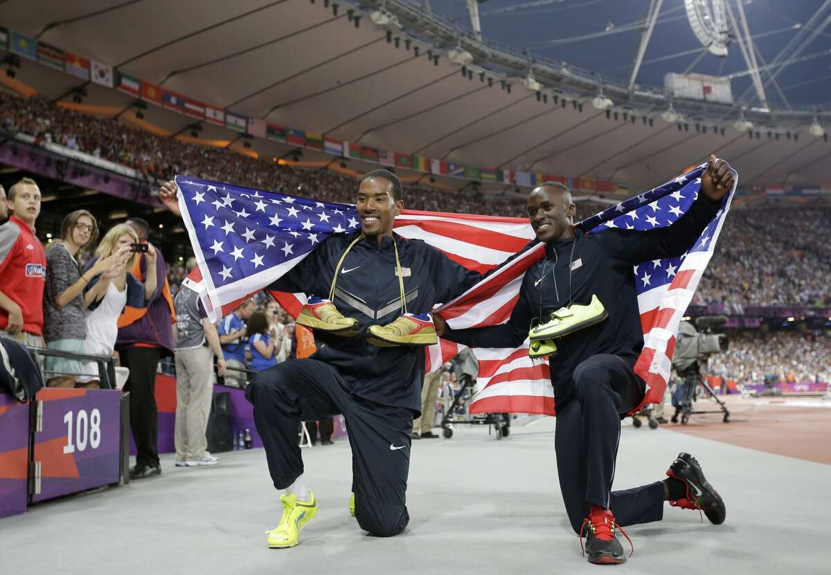 United States' gold medal winner Christian Taylor, left, and silver medal winner Will Claye celebrate with American flags after the men's triple jump final during the athletics in the Olympic Stadium at the 2012 Summer Olympics, London, Thursday, Aug. 9, 2012. (Matt Slocum / Associated Press)