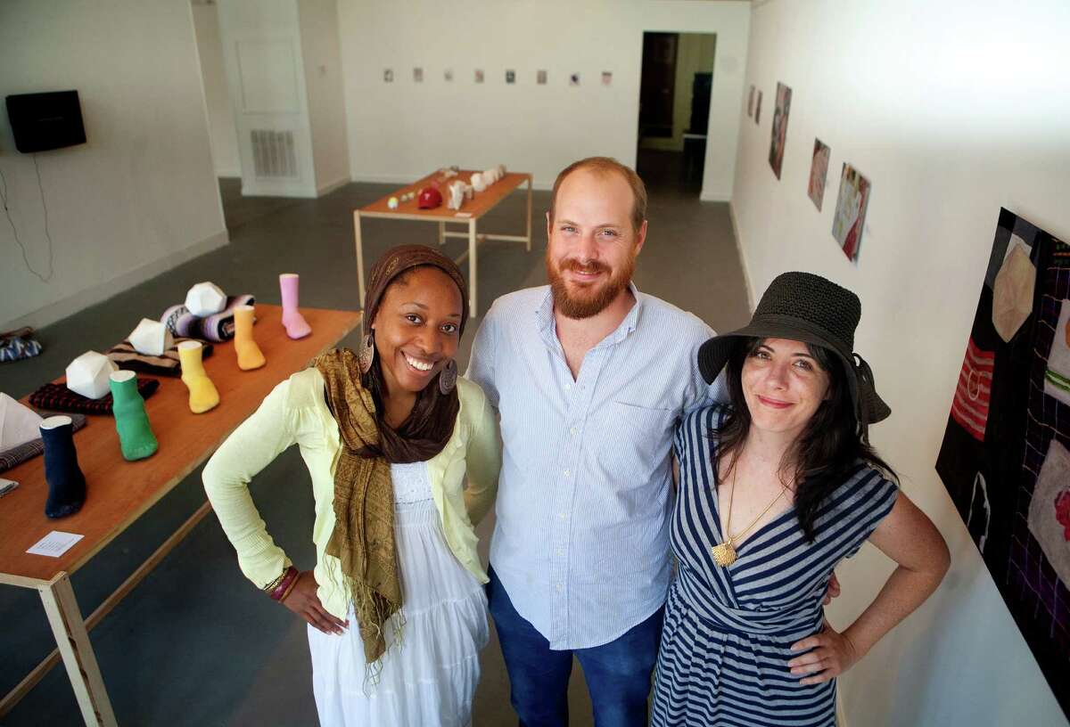 Artists Nsenga Knight, left, Nick Barbee, center, Kelly Sears, right, stand in the Galveston Arts Center Monday, July 16, 2012, in Galveston. (Cody Duty / Houston Chronicle)