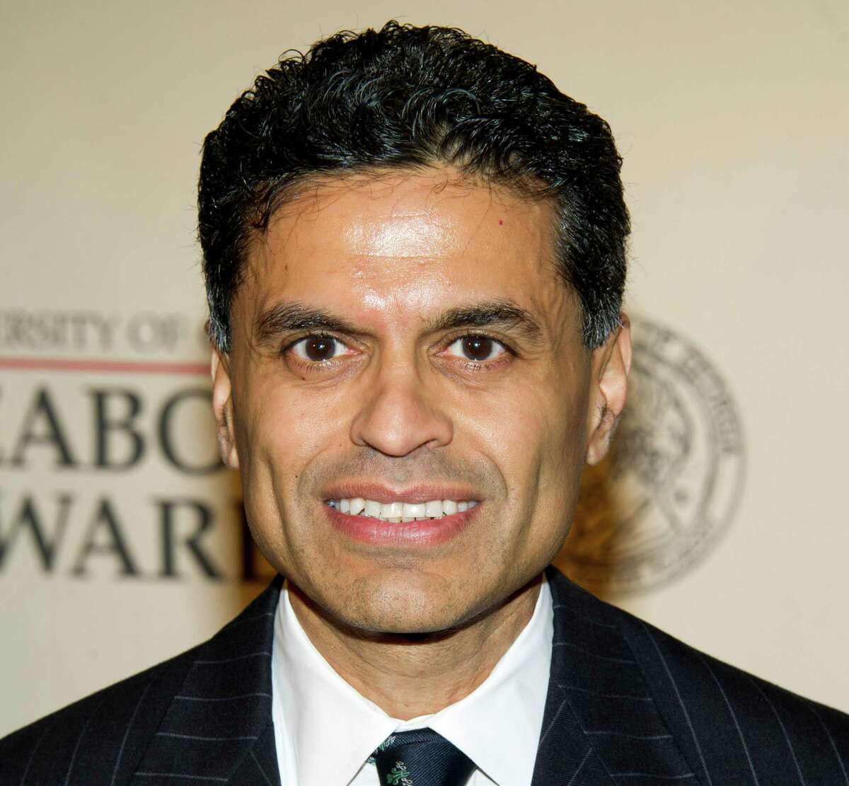 FILE - This May 21, 2012 file photo shows columnist and TV host Fareed Zakaria attending the 71st Annual Peabody Awards in New York. Zakaria is apologizing for lifting paragraphs by another writer for use in his column in Time magazine. Zakaria said in a statement Friday, Aug. 10, he made a "terrible mistake" and termed it "entirely my fault." Time magazine said it has suspended his column for one month pending further review. Media reporters had cited similarities between passages in Zakaria's column about gun control that appeared in Time's Aug. 20 issue, and paragraphs from an article by Harvard University history professor Jill Lepore published in April in The New Yorker magazine. (AP Photo/Charles Sykes, file)