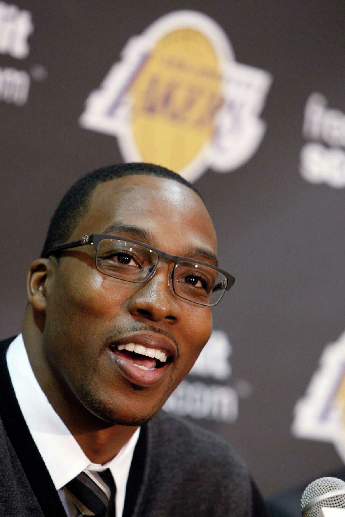 Center Dwight Howard, newly acquired by the Los Angeles Lakers from the Orlando Magic, speaks at a news conference at the NBA basketball team's headquarters in El Segundo, Calif., Friday, Aug. 10, 2012. (AP Photo/Reed Saxon)