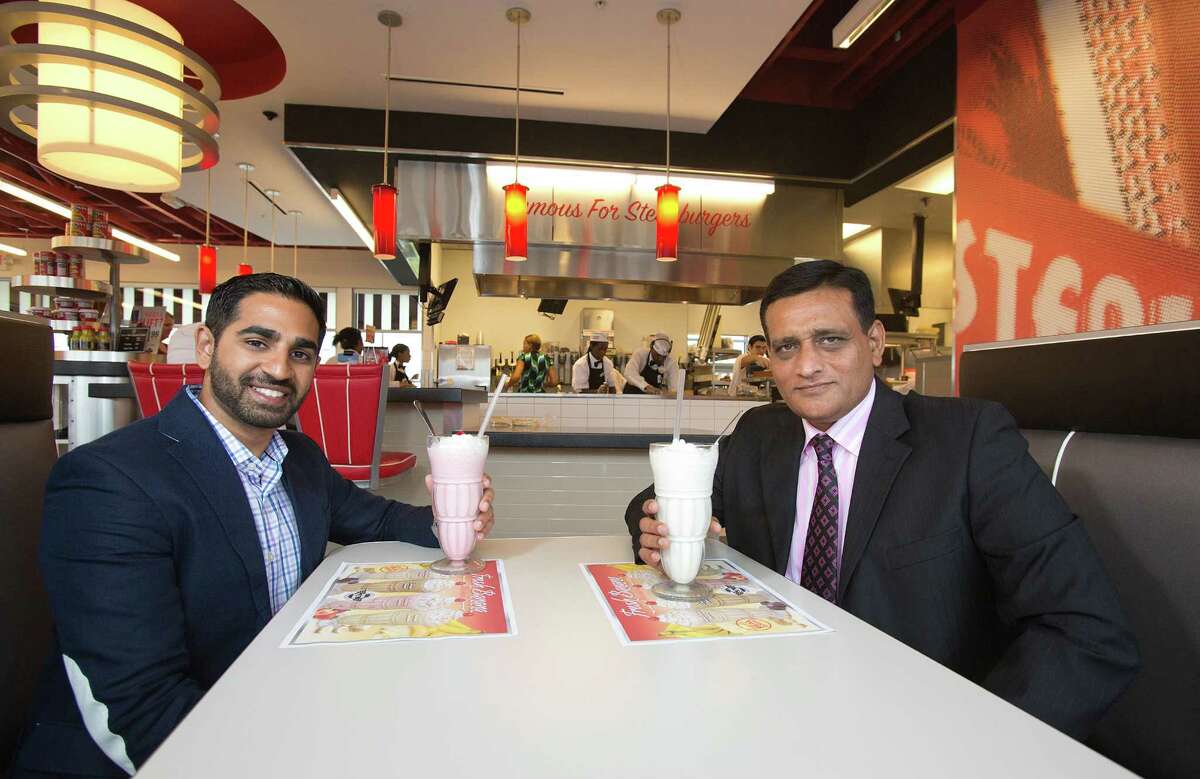 Anil Mohammed, left, vice president, and Moez Dhuka, president of SNS Franchise Ventures, expect to do more than just sip at success with their new Shake 'n Steak location in Pearland. Mohammed says he became a loyal customer at college in Atlanta.