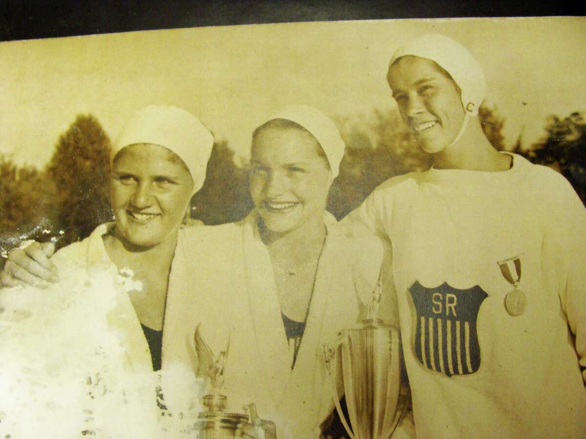 Norwalk native Marie Corridon Mortell, center, in a photograph taken at the Olympic trials leading up to the 1948 Summer Olympic Games in London, where she took home gold in the 4 X 100 freestyle relay. The photo in on display at the Norwalk YMCA.