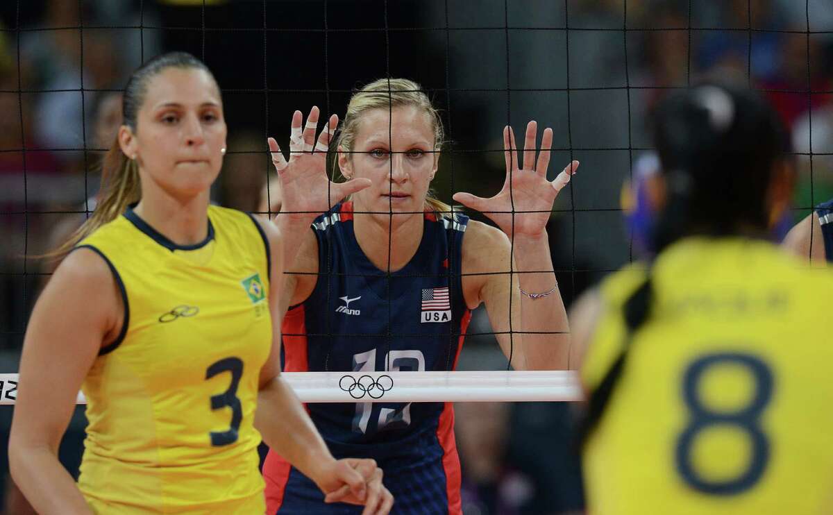 US Christa Harmotto (C) gestures during the women's volleyball gold medal match of the London 2012 Olympics Games against Brazil, in London on August 11, 2012. AFP PHOTO / KIRILL KUDRYAVTSEVKIRILL KUDRYAVTSEV/AFP/GettyImages