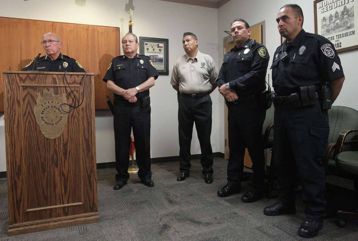 Bexar County Sheriff Amadeo Ortiz (left, at lectern) pauses while speaking to the media Monday August 6, 2012 at the Bexar County Sheriff's Office about two police dogs that died of heat exhaustion while in the care of Sheriff's Deputy Steve Benoy. Ortiz said Benoy forgot about the dogs and that the dogs died of heat exhaustion. Ortiz said measures are being taken to insure this doesn't happen again. Benoy is on administrative leave with pay.