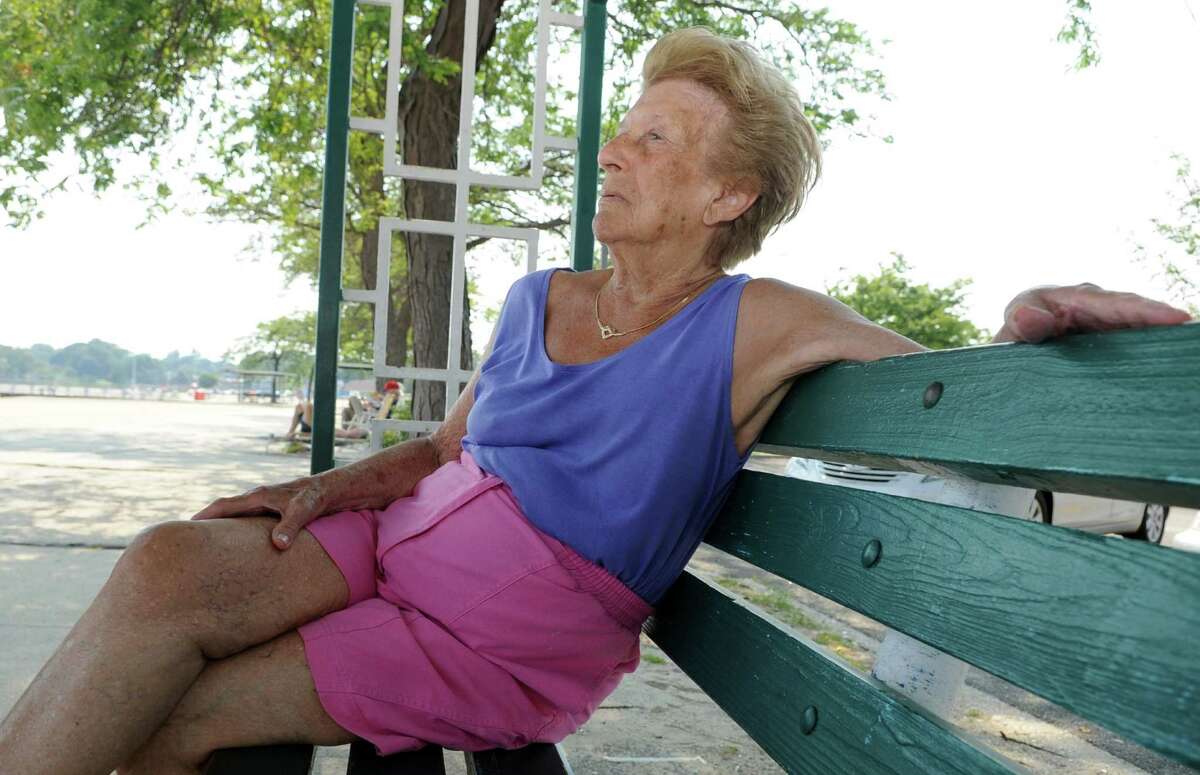 Marie Scime, 88, talks about Tuesday's primary election while relaxing at Cummings Beach in Stamford on Thursday, August 9, 2012.