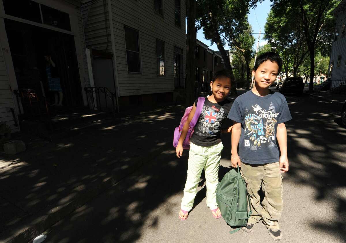 Ten-year-old Eh Thaw Soe, left, and her 12-year-old brother Ken Blu Soe in Albany NY Saturday July 21, 2012. (Michael P. Farrell/Times Union)