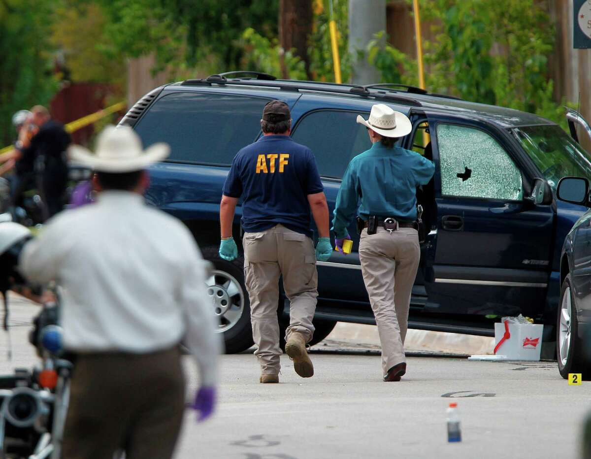 Investigators on Monday examine the College Station scene where seven people were shot in a hail of bullets.