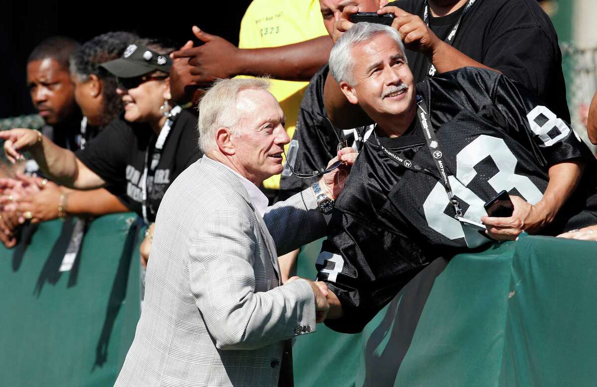 Dallas Cowboys owner Jerry Jones shakes hands with fans before an NFL preseason football game against the Oakland Raiders in Oakland, Calif., Monday, Aug. 13, 2012. (AP Photo/Tony Avelar)