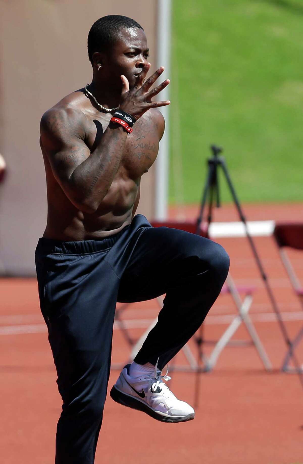 United States long jumper Marquise Goodwin trains for the 2012 Summer Olympics, Monday, July 23, 2012, in Birmingham, England. The opening ceremonies of the Olympic Games are scheduled for Friday, July 27. (AP Photo/Hussein Malla)