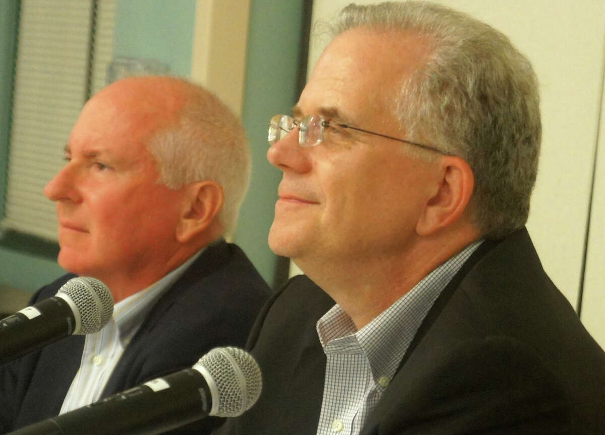 Board of Education Chairman Don O'Day, right, resigned from the post Monday night, saying he wants to focus more attention on his profession. He recommended Jim Marpe, left, the board's vice chariman, succeed him as chairman.