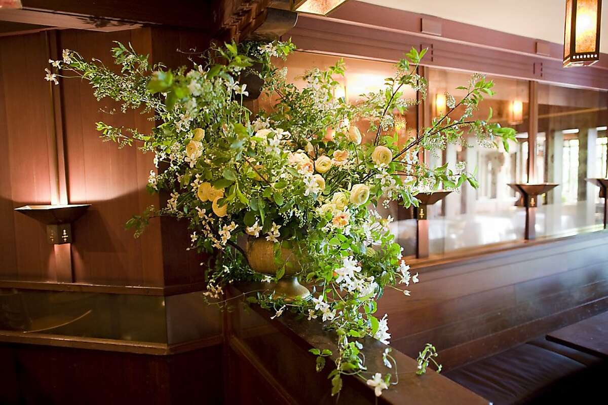 The main bouquet is a mix of Bird Cherry Branches, Montana Clematis, Ranunculus, and Nasturtium flowers, which are all locally sourced. Max Gill is a long time floral designer for Chez Panisse in Berkeley CA. Thursday April 26th, 2012.