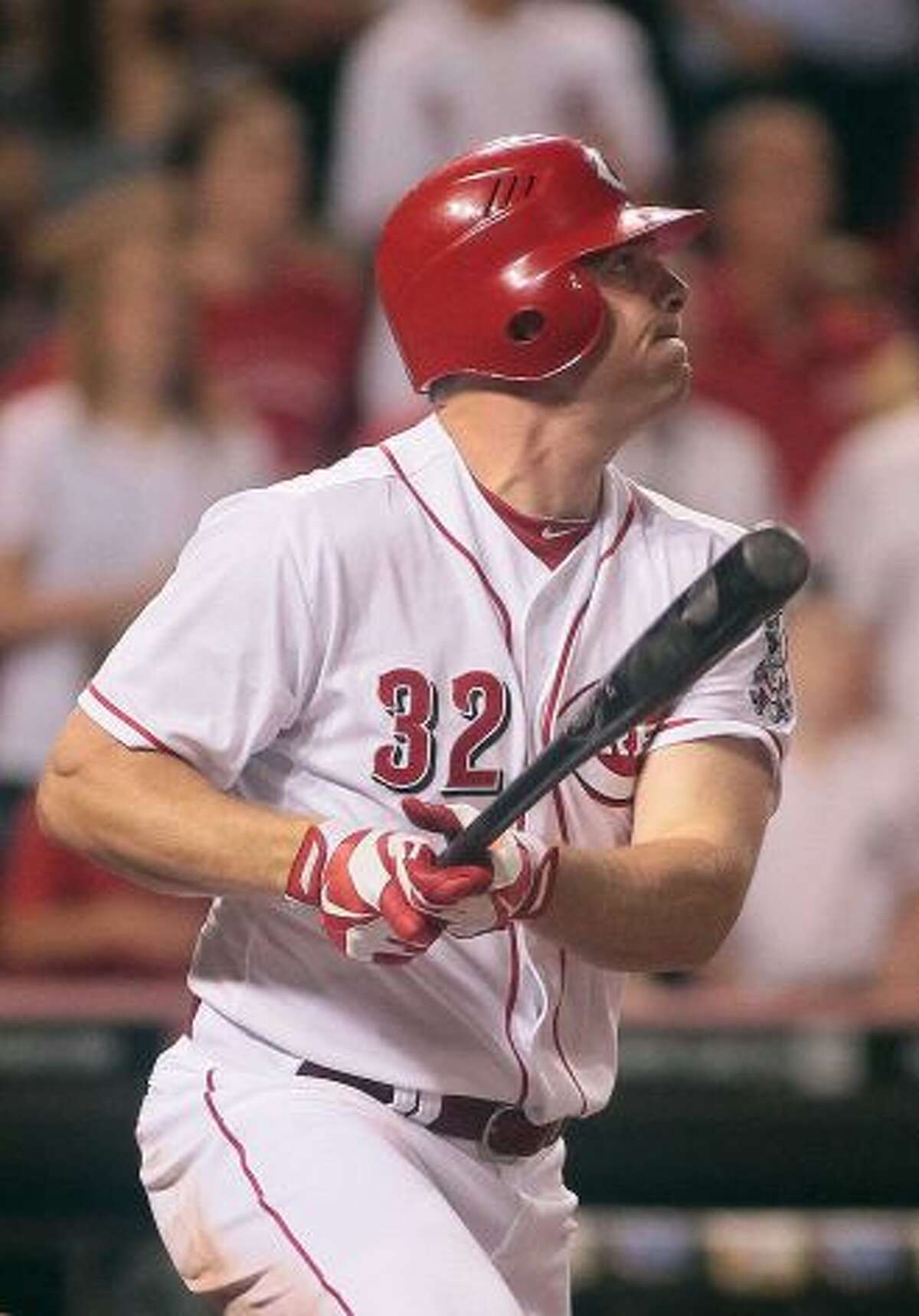 Cincinnati Reds' Jay Bruce watches his three-run home run off of New York Mets reliever Josh Edgin scoring Brandon Phillips and Ryan Ludwig in the ninth inning of a baseball game, Tuesday, Aug. 14, 2012, in Cincinnati. The Red won 3-0. Photo: Tony Tribble / AP