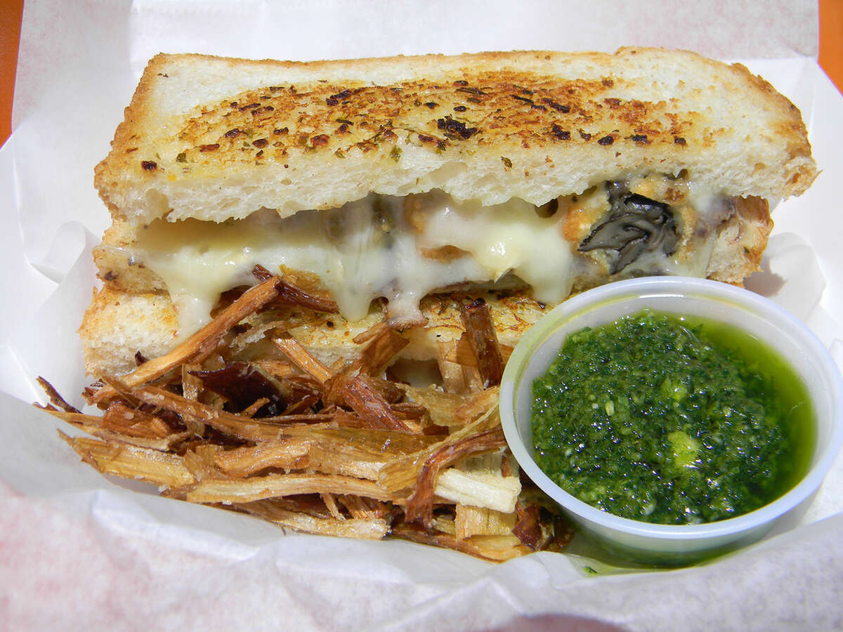 The Ladybird﻿ food bus serves its Escargot Grilled Cheese Sandwich with fried leeks and a garlic and parsley dipping sauce.