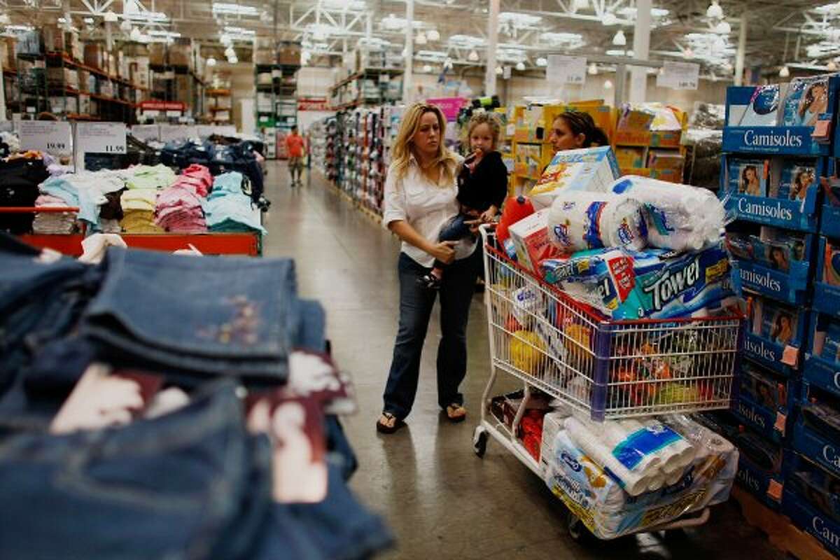 On top of looking at the “Costco craze,” CNBC delves into the “Costco effect,” otherwise known as the “routine tendency” to spend more than you had wanted. (Joe Raedle / Getty Images)