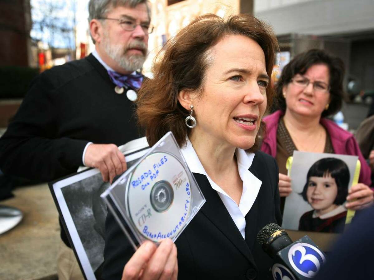 Anne Barrett Doyle, co-director of Bishop Accountability. org, shows a cd which she planned to deliver to the state's attorney which compiled the thousands of released files in the Roman Catholic Diocese of Bridgeport sex abuse cases into a single readable file. Barrett Doyle believes the information was released as thousands of separate pdf files as a way to prevent easy access to material.