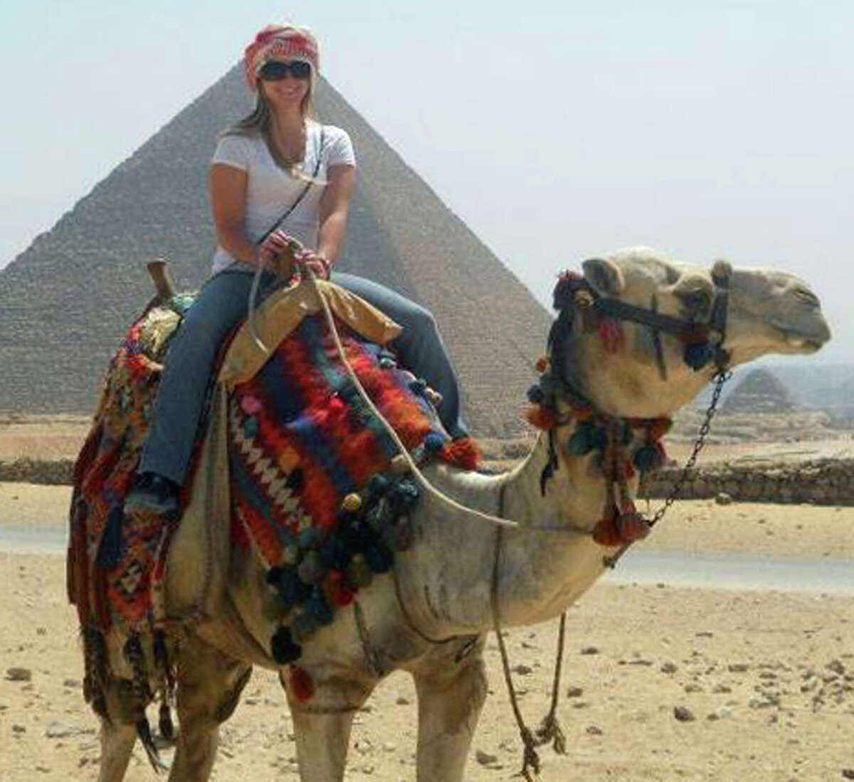 A camel ride proves a high point for Boston University student Alex Hopkins as she experiences the pyramids during her summertime trip to Egypt. July 2012 Courtesy of the Hopkins family