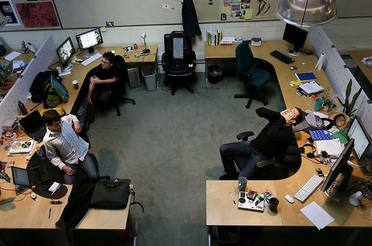 dropouts085.JPG After a long day, Evan Williams, far right, stretches at his workspace while Jack Dorsey, left and Biz Stone, rear left, talk with Williams about a project. Evan Williams, founder of Obvious Corp., dropped out of the University of Nebraska after just one year. He now epitomizes the fiercely independent, highly individualistic and self-powered streak that characterizes most Silicon Valley dropouts. He is photographed at his company, Obvious Corp. on South Park in San Francisco. {Brant Ward/San Francisco Chronicle}11/28/06