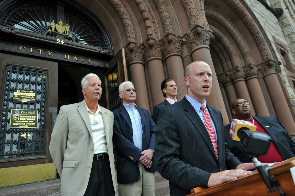 Lee Kindlon, Democratic candidate for Albany County District Attorney, second from right, speaks on the steps of City Hall after receiving the endorsement of Albany Common Council members Joseph M. Igoe, far left, Daniel F. Herring, second from left, John Rosenzweig, center, and Ronald E. Bailey, far right, on Wednesday Aug. 15, 2012 in Albany, NY. (Philip Kamrass / Times Union)