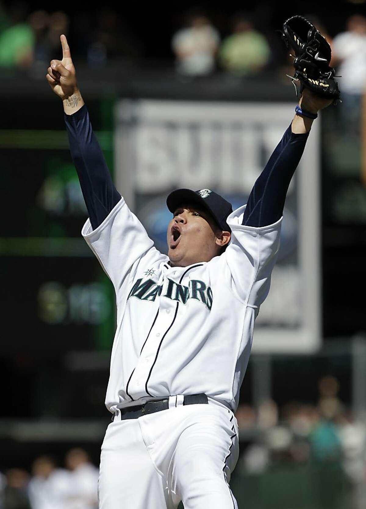 Seattle Mariners pitcher Felix Hernandez reacts after throwing a perfect game to end the ninth inning of baseball game against the Tampa Bay Rays, Wednesday, Aug. 15, 2012, in Seattle. The Mariners won 1-0. (AP Photo/Ted S. Warren)