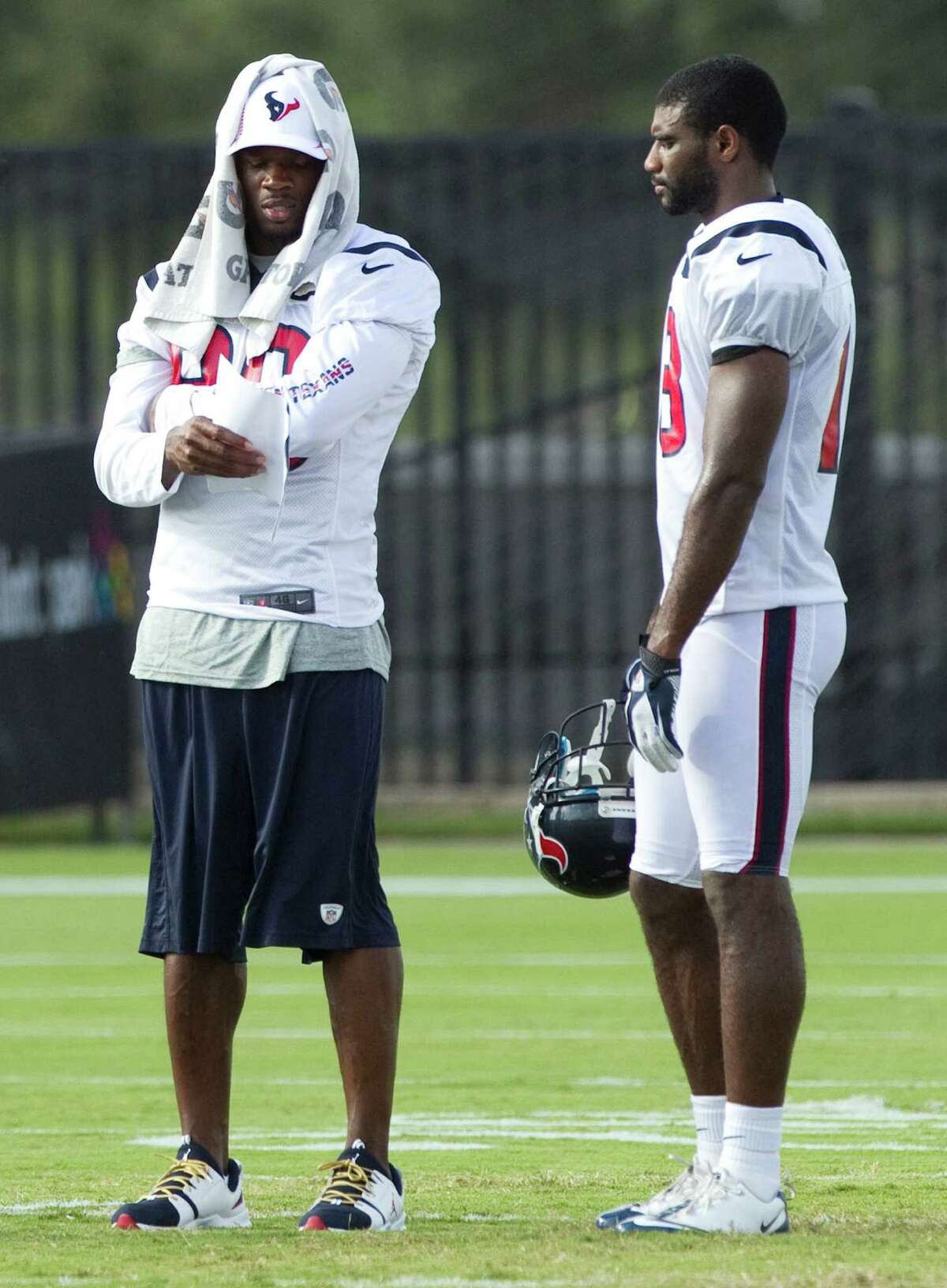 Second-year receiver Lestar Jean, right, isn't shy about picking the brain of five-time Pro Bowler Andre Johnson during training camp.