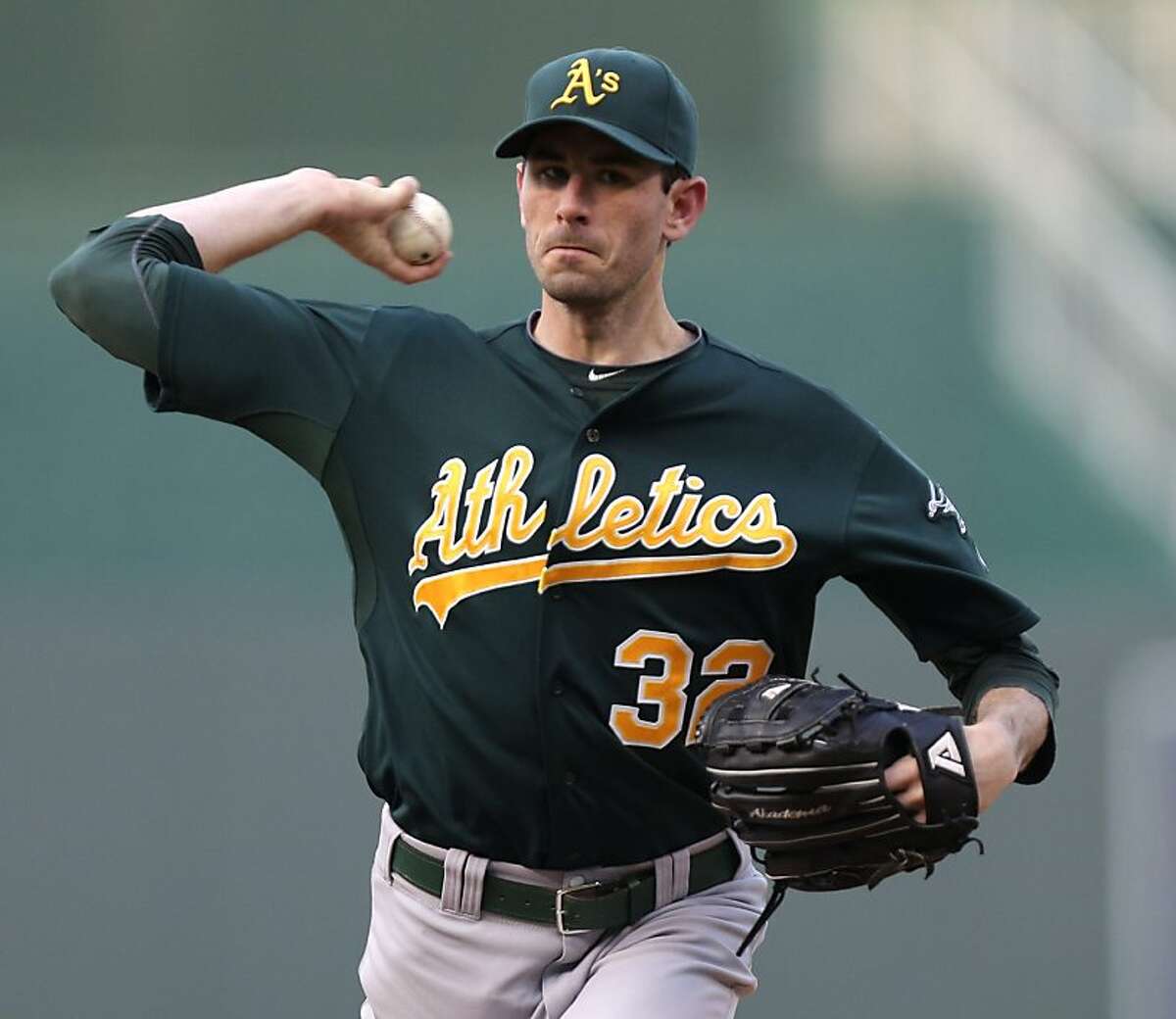 KANSAS CITY, MO - AUGUST 15: Brandon McCarthy #32 of the Oakland Athletics warms up during a game against the Kansas City Royals in the first inning on August 15, 2012 at Kauffman Stadium in Kansas City, Missouri. (Photo by Ed Zurga/Getty Images)
