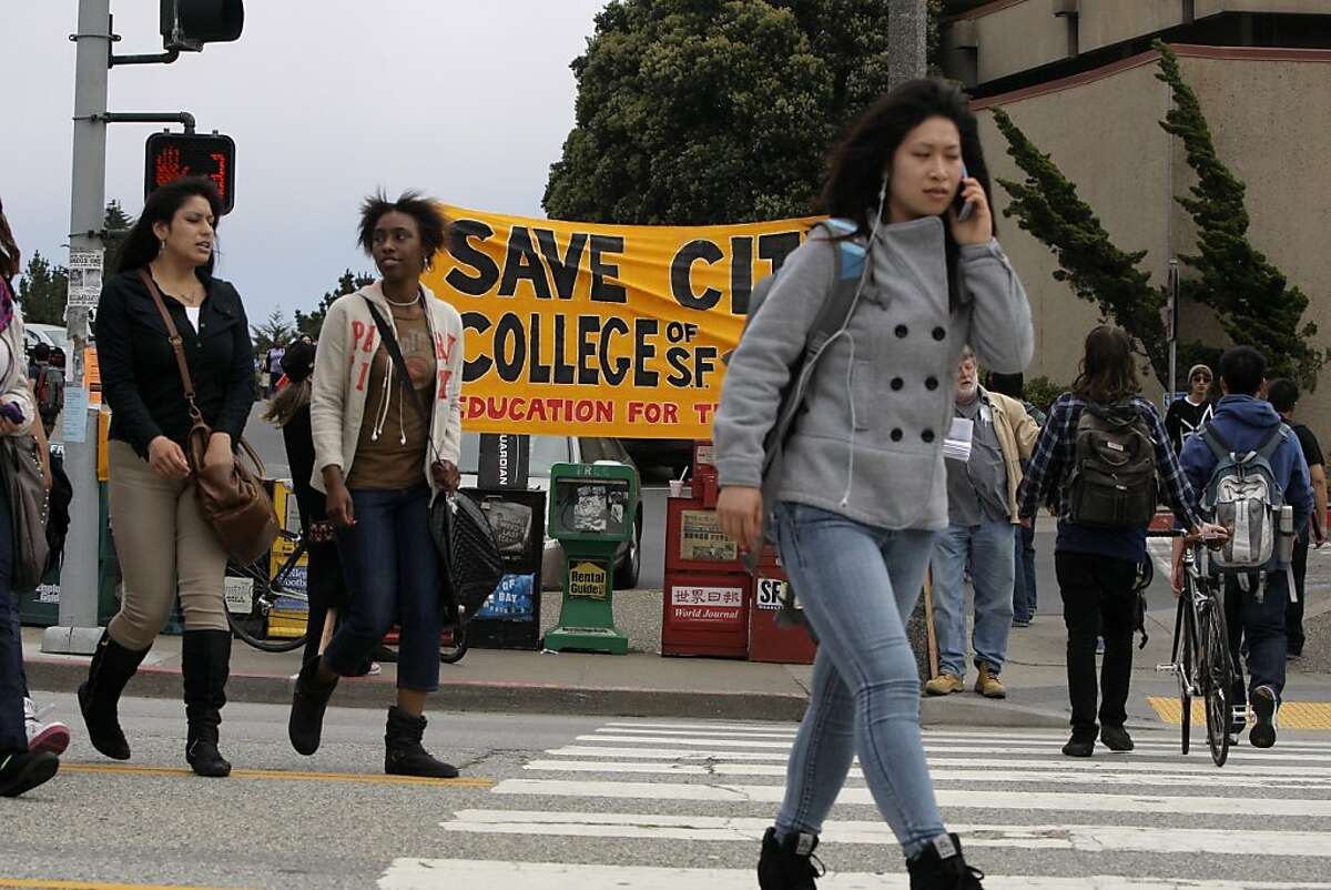 Students cross Phelan Street at the City College of San Francisco on Wednesday, August 15, 2012, in San Francisco, Calif.